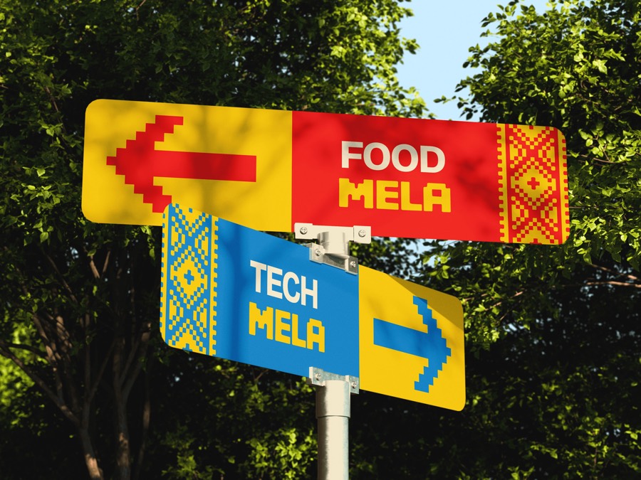 Street signs pointing to Food Mela and Tech Mela